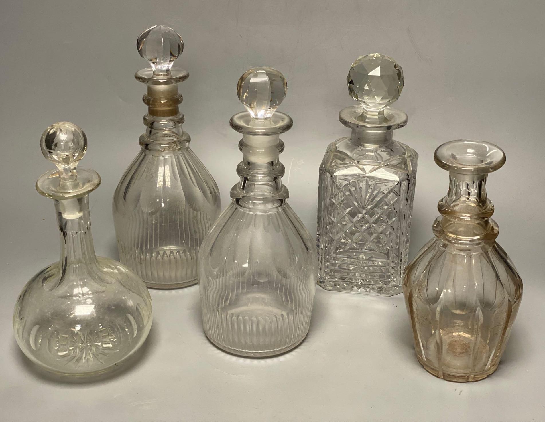 A pair of Regency glass mallet decanters with stoppers, 27cm and three other decanters (5)